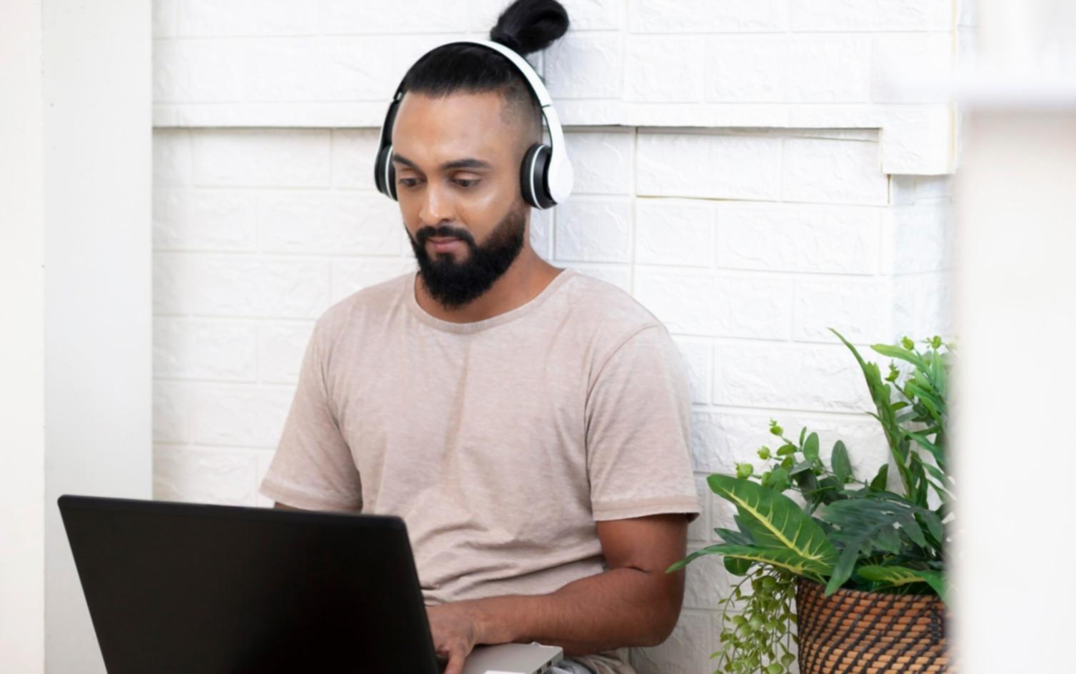 Person reviewing investment documents at a comfortable home office setup